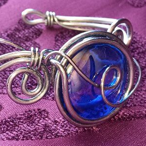 Irodescent beautiful moonstone?, in the middle of a one of a kind wire bracelet.